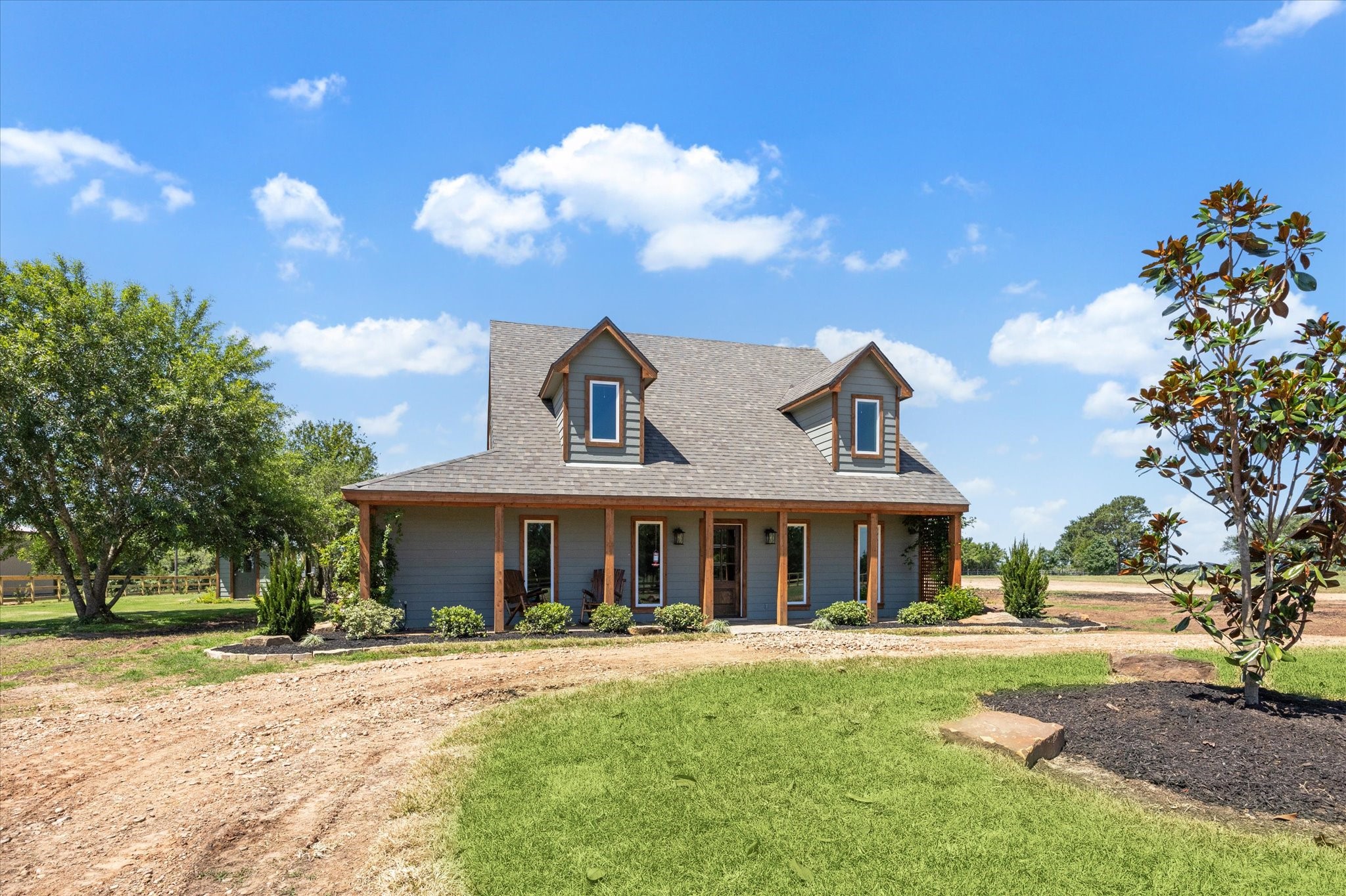 6063 Fm 1094 Sealy, TX 77474 - Photo 6 of 47 a front view of a house with a yard and trees
