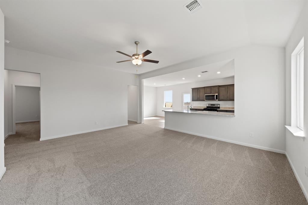 13413 Hang Fire Lane Cresson, TX 76035 - Photo 3 of 8 a view of a kitchen with a sink and a stove top oven