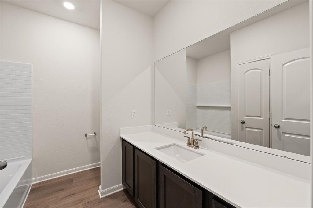13413 Hang Fire Lane Cresson, TX 76035 - Photo 7 of 8 a bathroom with a sink and a mirror