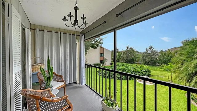 a view of a balcony with furniture