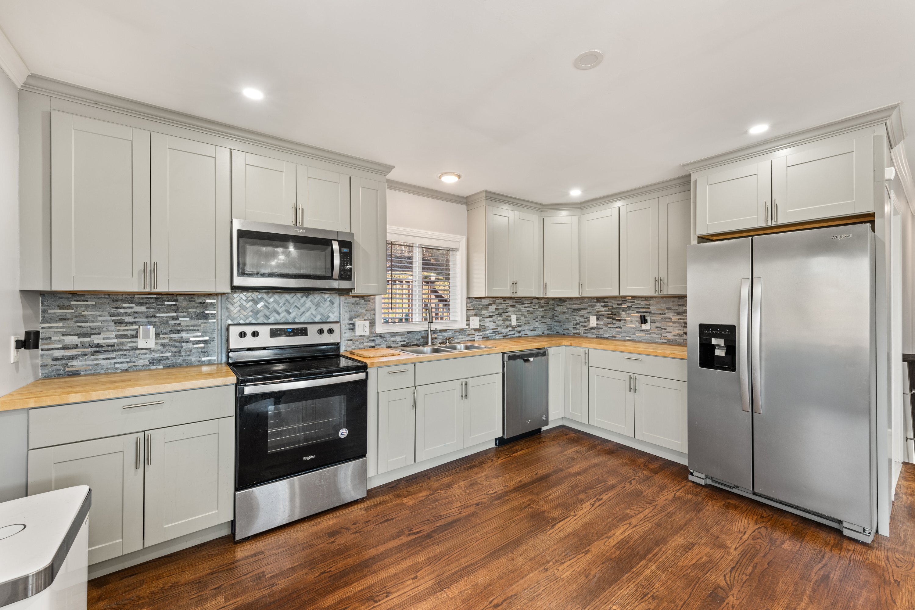 3 Highland Avenue Ansonia, CT 06401 - Photo 18 of 38 a kitchen with a refrigerator stove top oven and sink