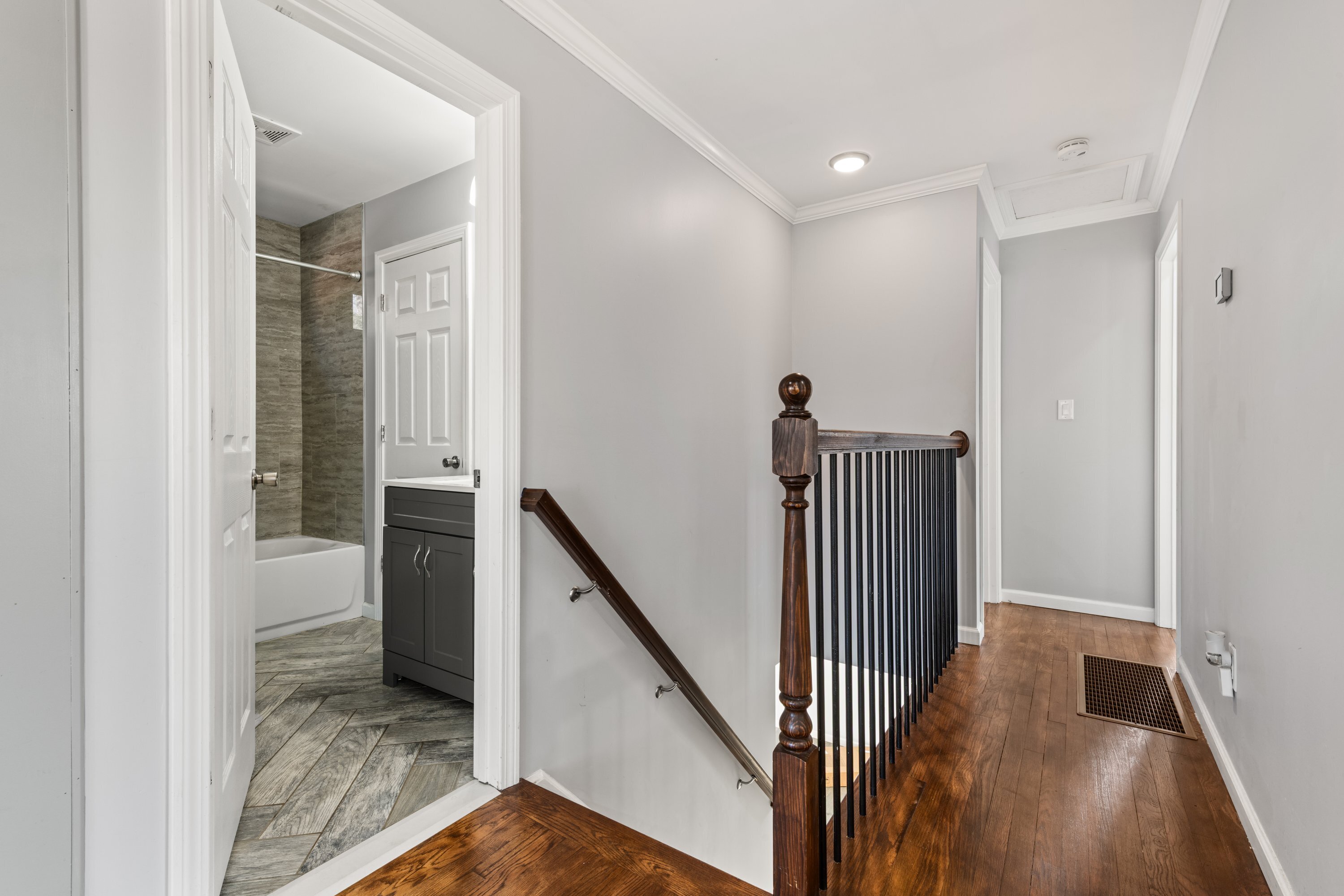 3 Highland Avenue Ansonia, CT 06401 - Photo 21 of 38 a view of a hallway with wooden floor and staircase