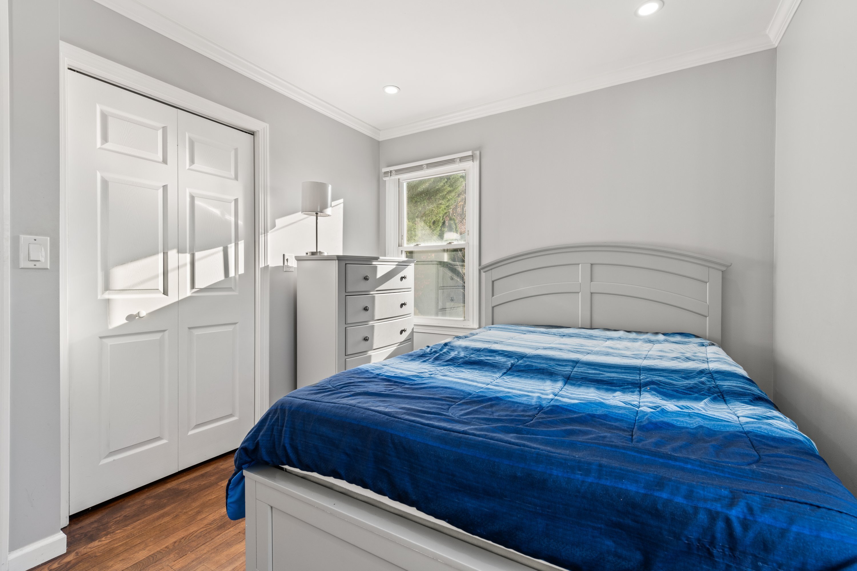 3 Highland Avenue Ansonia, CT 06401 - Photo 25 of 38 a bedroom with a bed and wooden floor