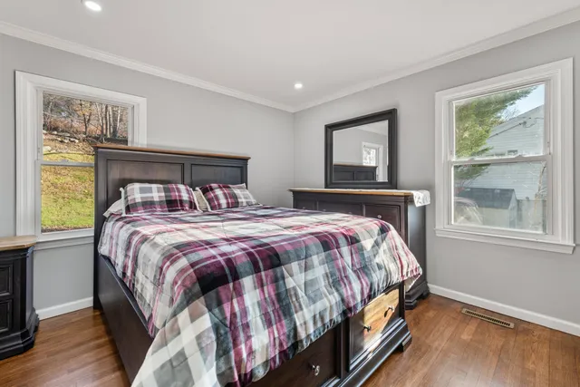 a bedroom with a bed and window