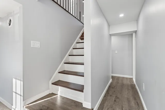 a view of entryway with wooden floor