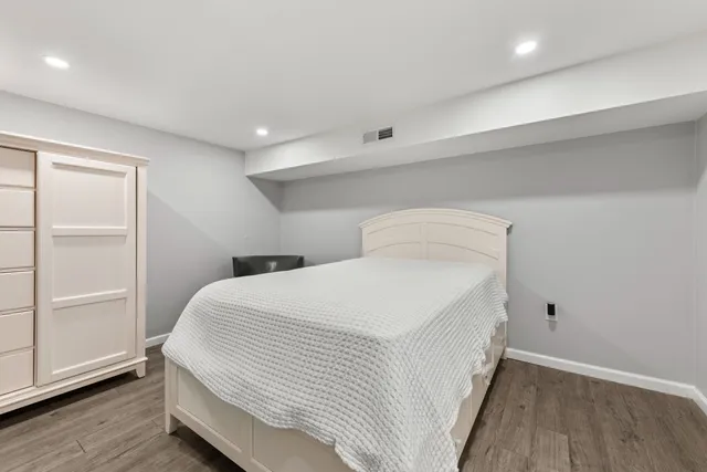 a bedroom with a bed and a closet