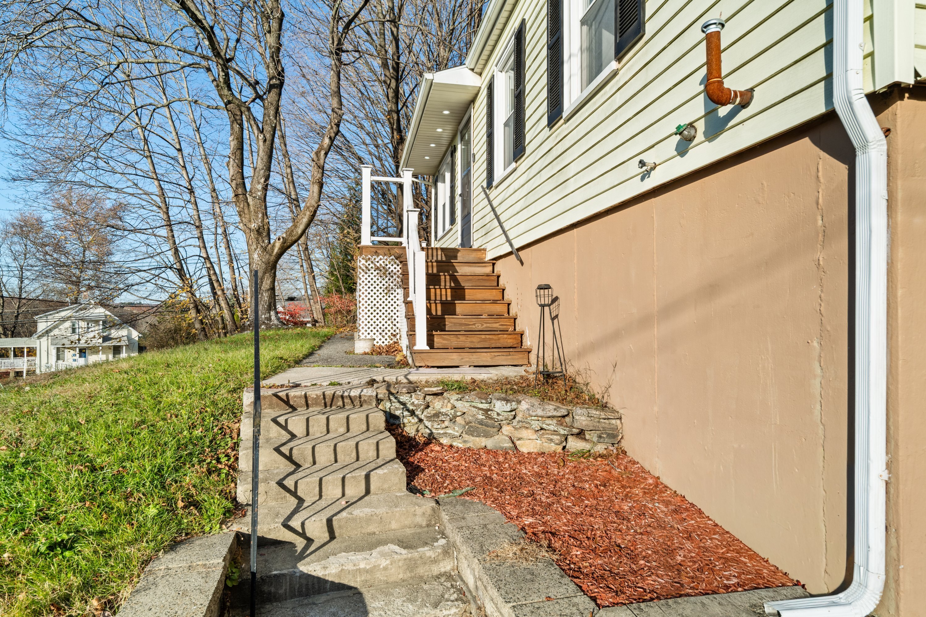 3 Highland Avenue Ansonia, CT 06401 - Photo 5 of 38 a view of a pathway of a house with a yard