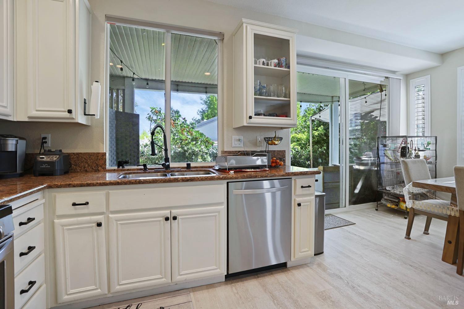 234 Cedar Ridge Drive Rio Vista, CA 94571 - Photo 16 of 33 a kitchen with white cabinets and window