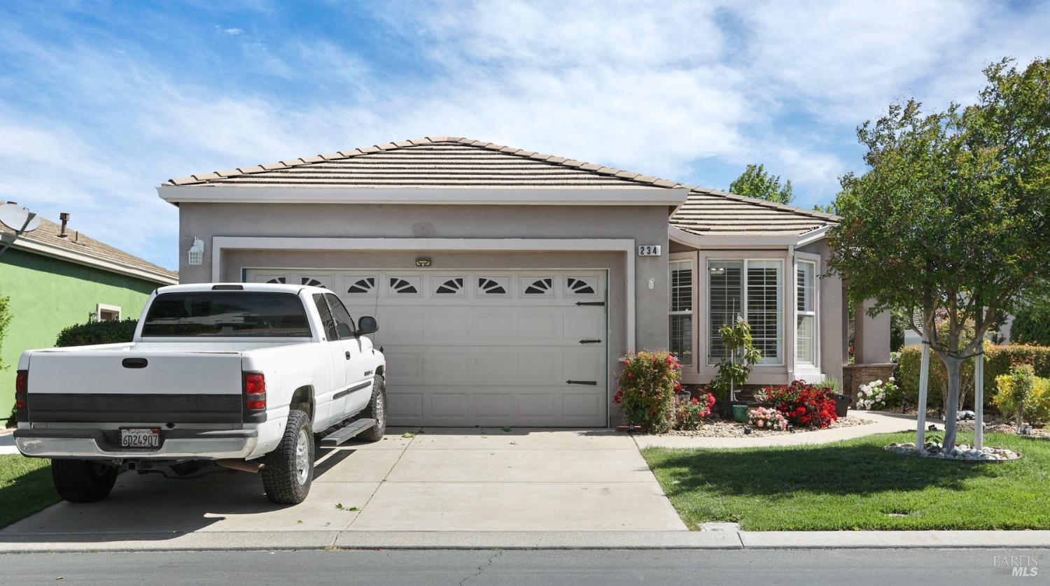 234 Cedar Ridge Drive Rio Vista, CA 94571 - Photo 2 of 33 a front view of a house with garage