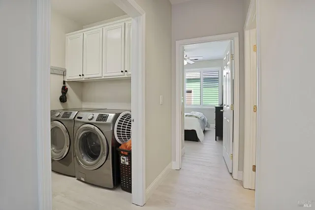 a utility room with dryer and washer