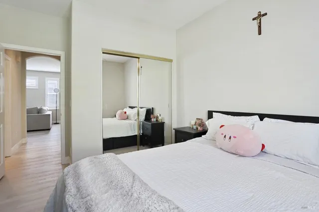 a bedroom with a bed and a view of bathroom