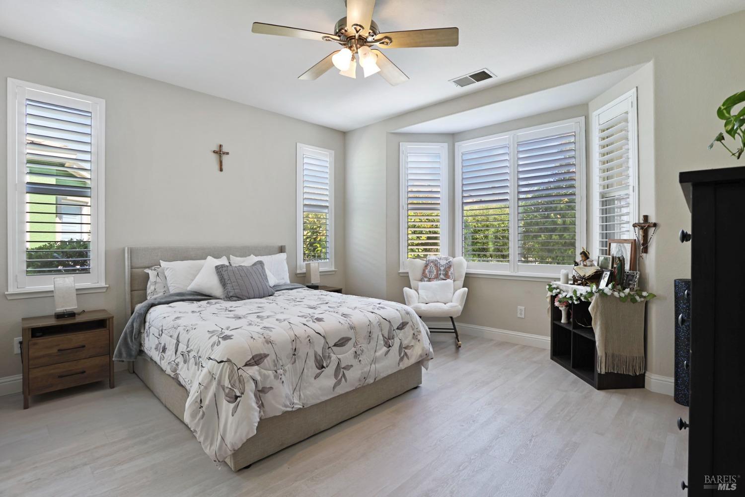 234 Cedar Ridge Drive Rio Vista, CA 94571 - Photo 27 of 33 a bedroom with a bed and a chandelier