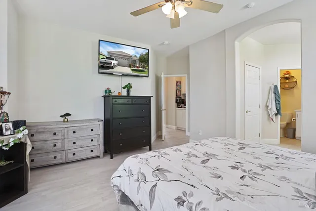 a bedroom with a bed and a dresser in it