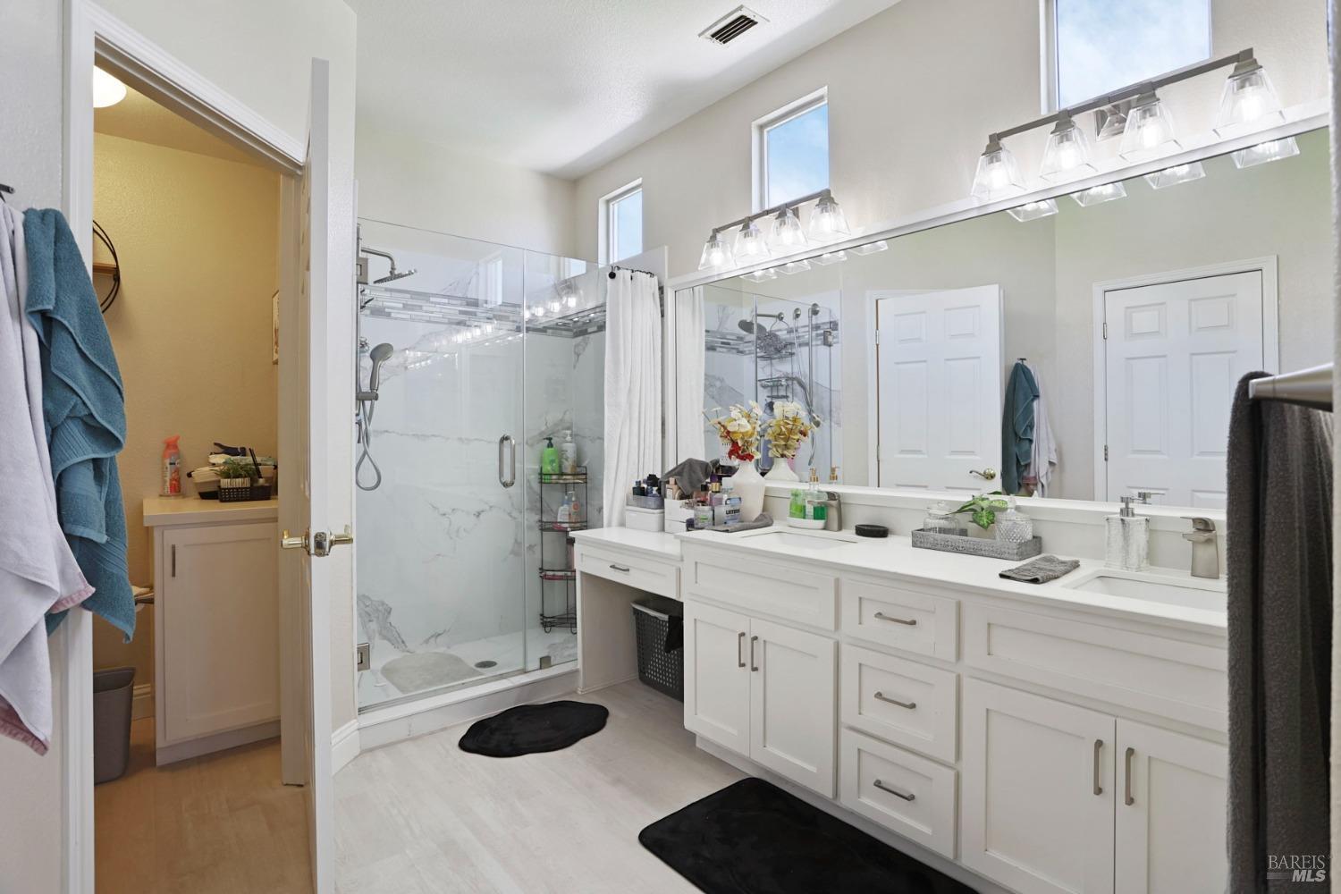 234 Cedar Ridge Drive Rio Vista, CA 94571 - Photo 29 of 33 a spacious bathroom with a sink a shower and a mirror