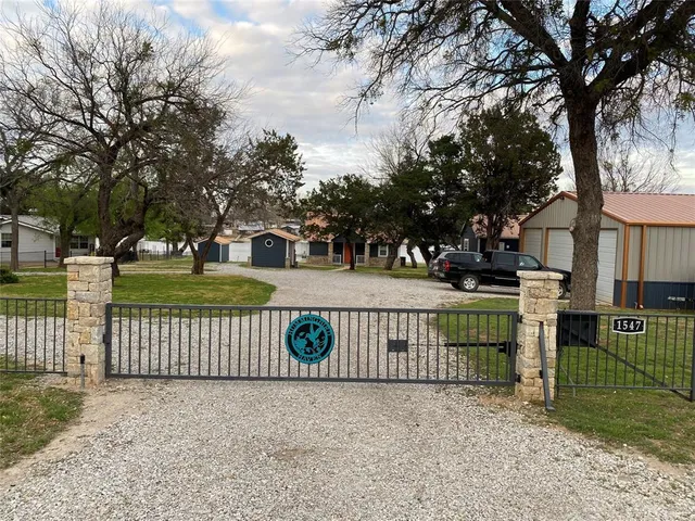 a view of a park with iron fence