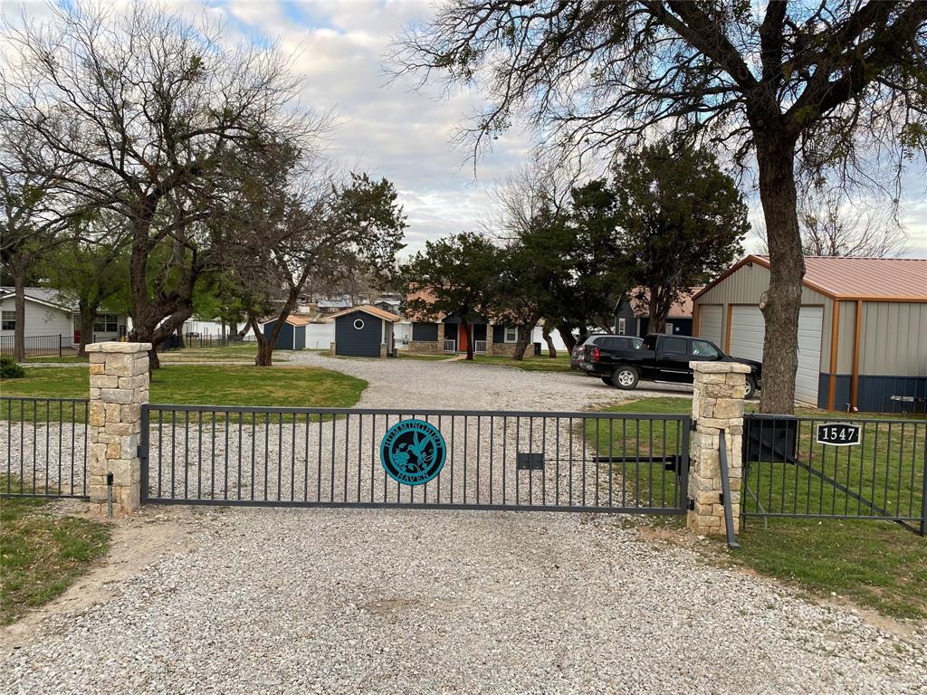 a view of a park with iron fence