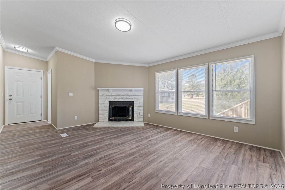 515 Mt Zion Road Red Springs, NC 28377 - Photo 3 of 50 wooden floor fireplace and windows in an empty room