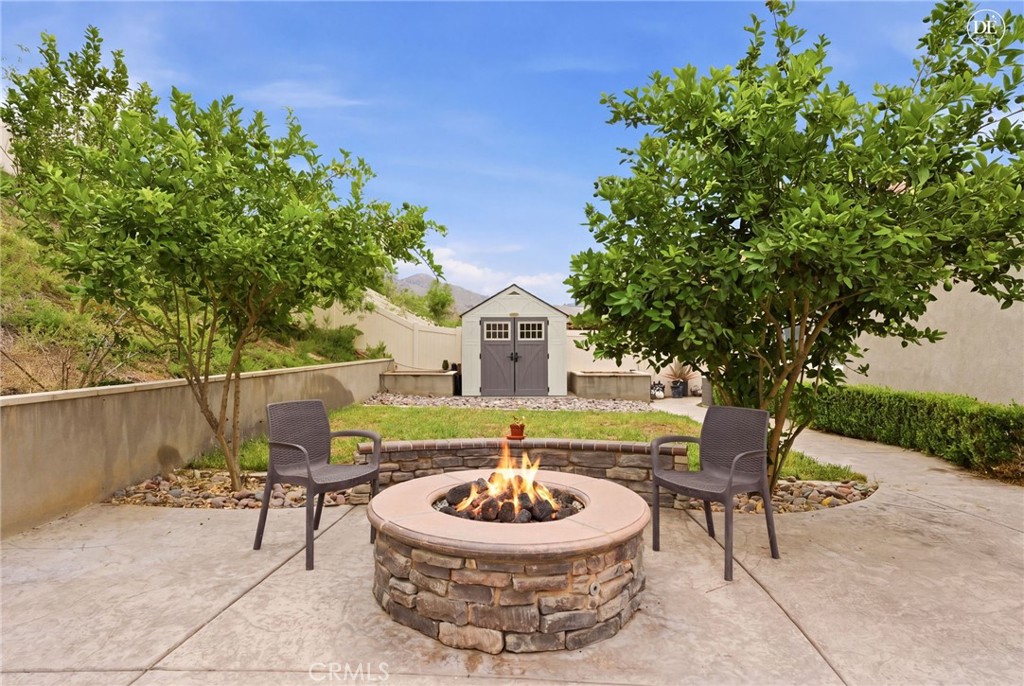20948 Center Street Riverside, CA 92507 - Photo 75 of 92 a view of a chairs and table in the backyard