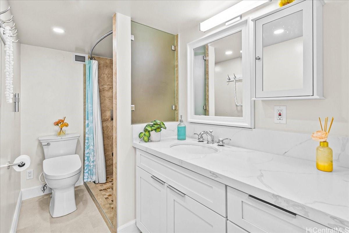 3215 Ala Ilima Street, Unit A/PH2 Honolulu, HI 96818 - Photo 13 of 25 a bathroom with a sink and a mirror