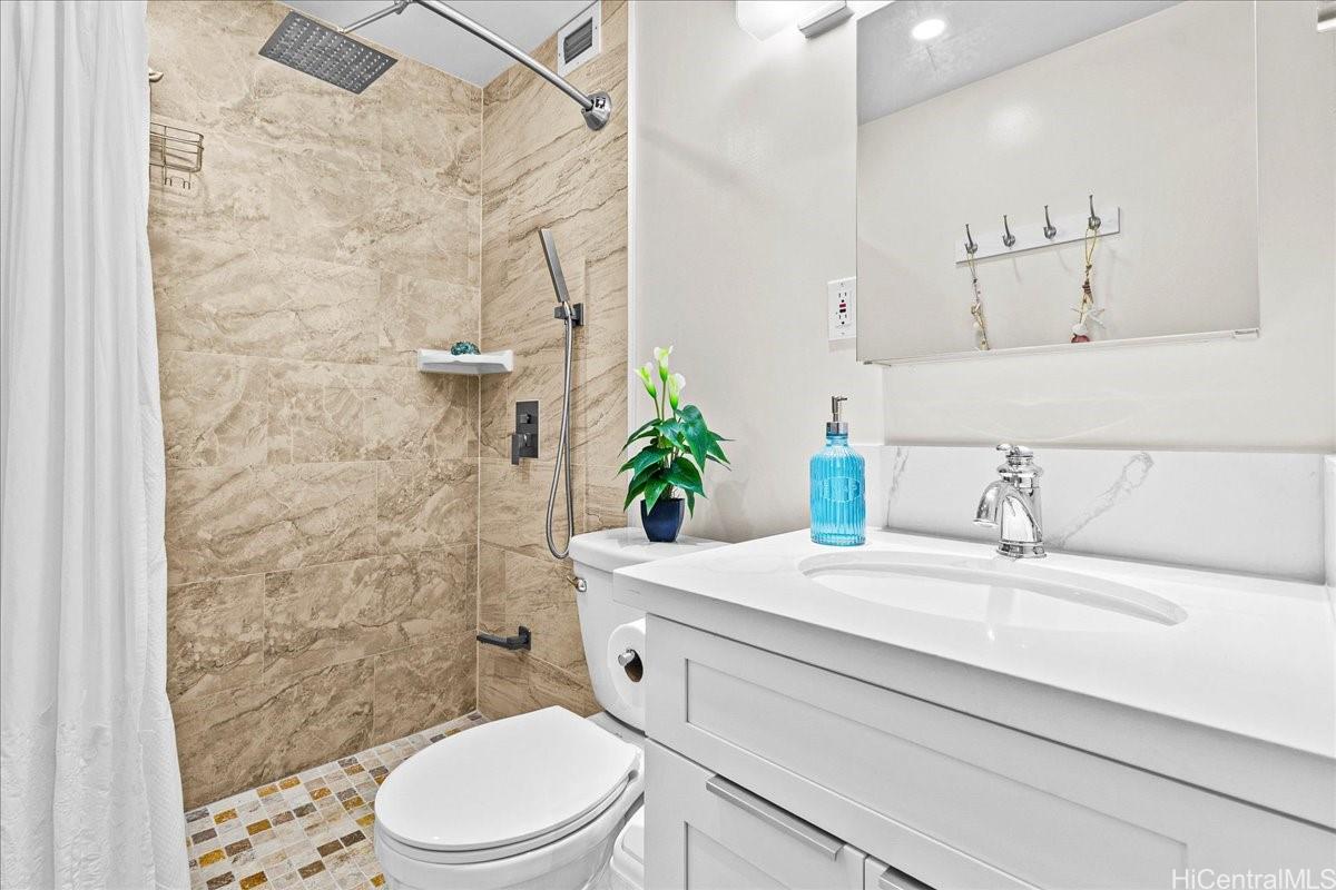 3215 Ala Ilima Street, Unit A/PH2 Honolulu, HI 96818 - Photo 16 of 25 a bathroom with a sink a toilet and shower