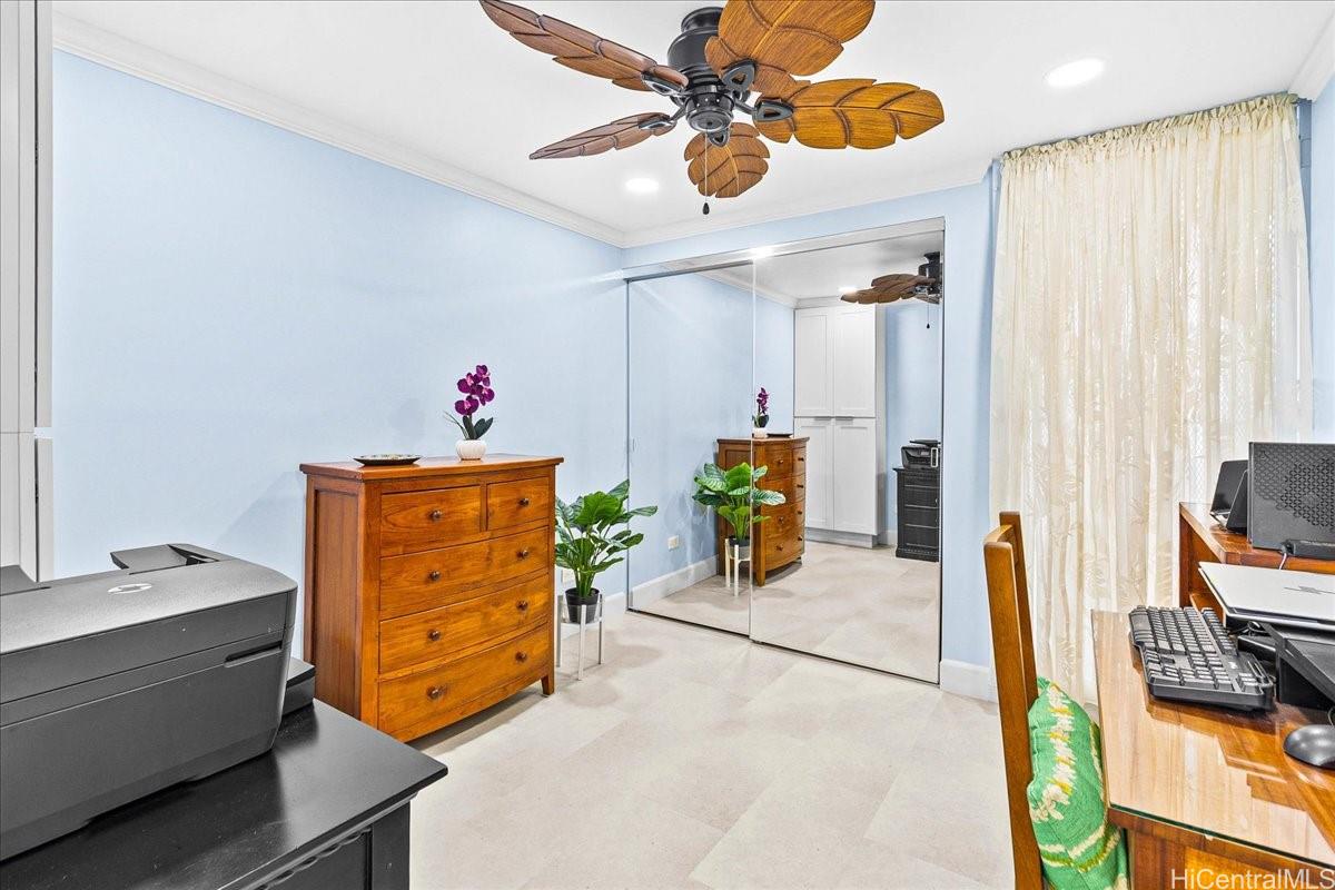 3215 Ala Ilima Street, Unit A/PH2 Honolulu, HI 96818 - Photo 17 of 25 a bedroom with a bed and a chandelier