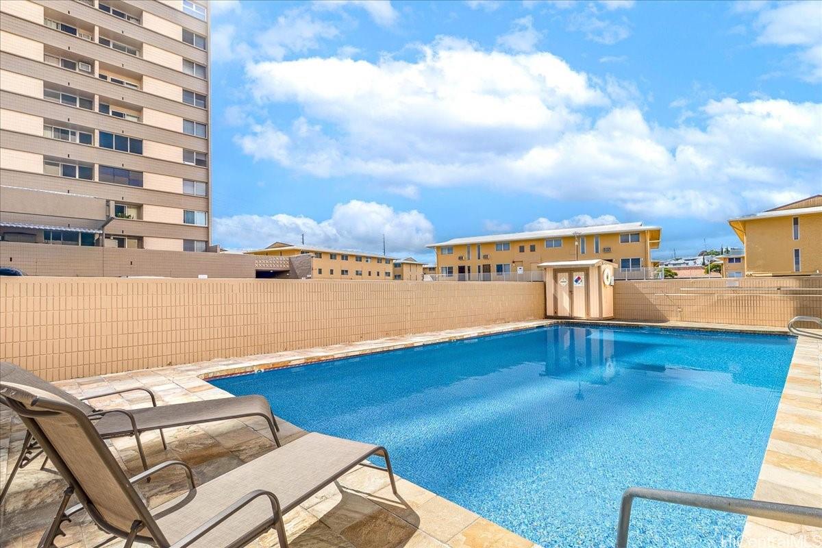3215 Ala Ilima Street, Unit A/PH2 Honolulu, HI 96818 - Photo 18 of 25 a view of a swimming pool with an ocean view