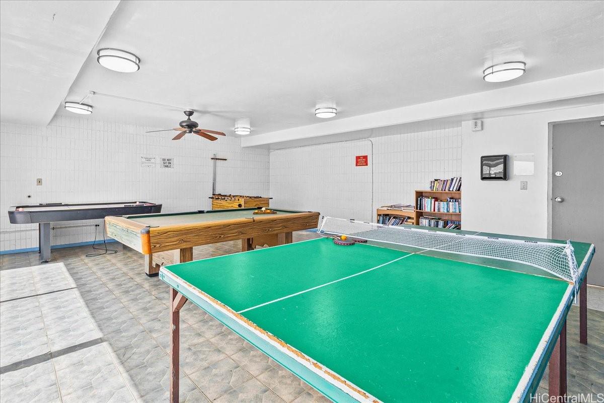 3215 Ala Ilima Street, Unit A/PH2 Honolulu, HI 96818 - Photo 21 of 25 a room with pool table and chairs