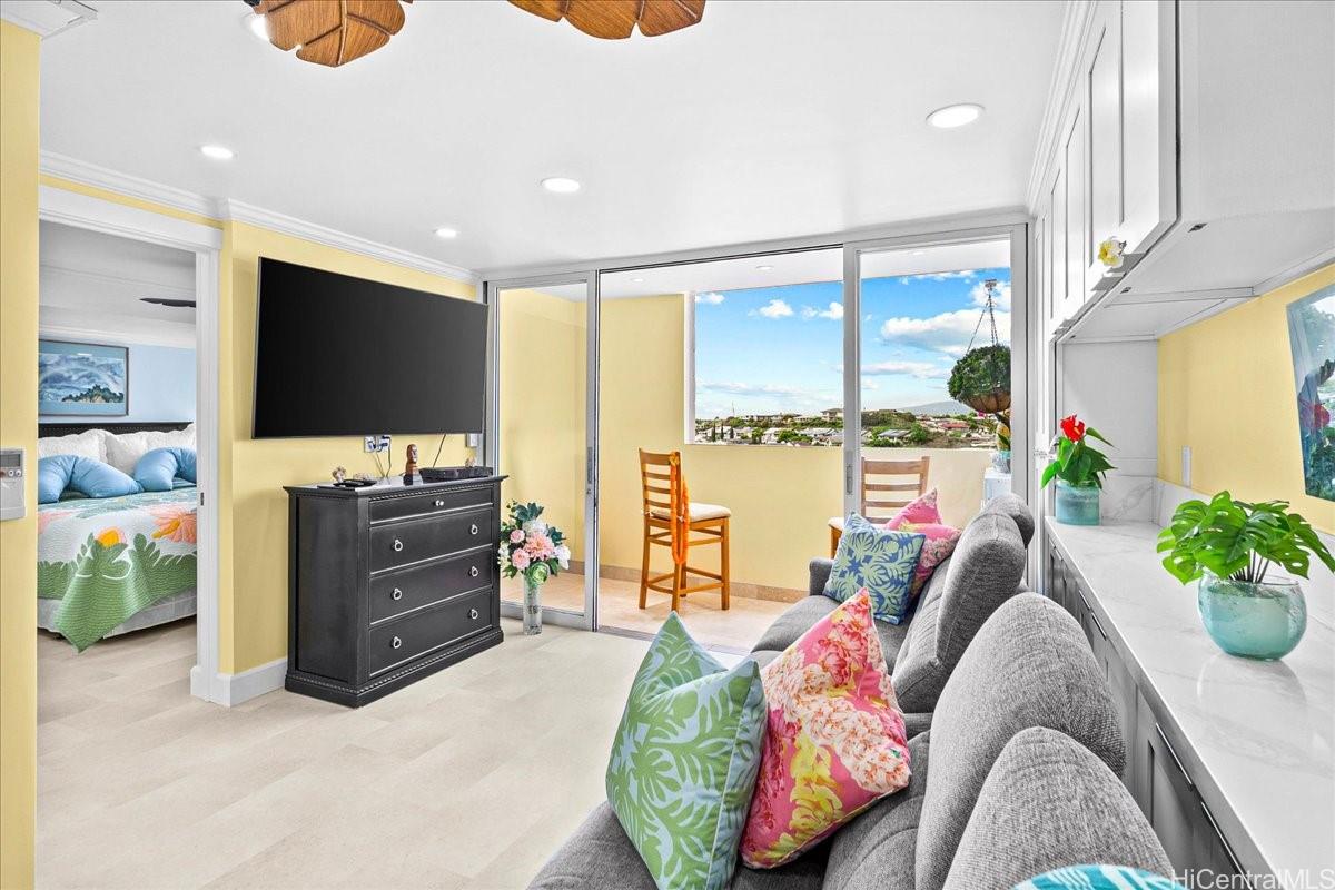 3215 Ala Ilima Street, Unit A/PH2 Honolulu, HI 96818 - Photo 7 of 25 a living room with furniture and a flat screen tv