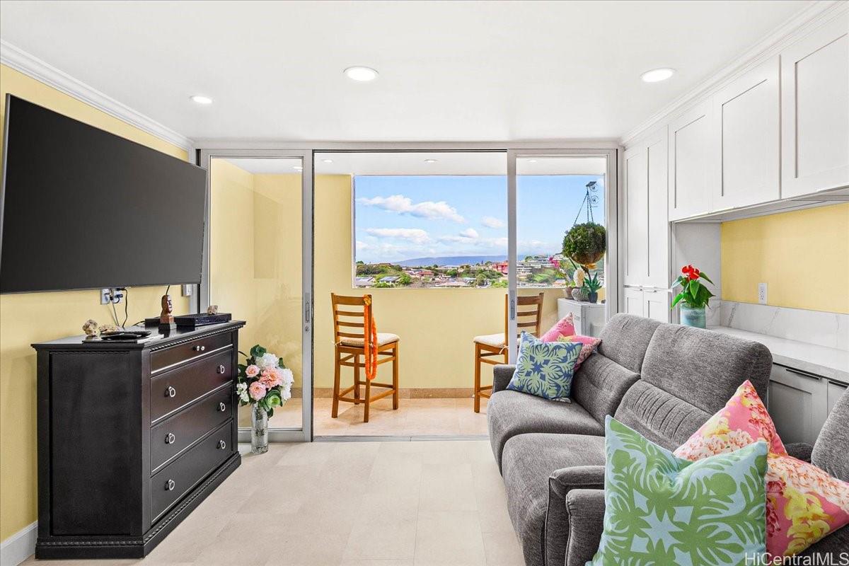 3215 Ala Ilima Street, Unit A/PH2 Honolulu, HI 96818 - Photo 8 of 25 a living room with furniture and a flat screen tv