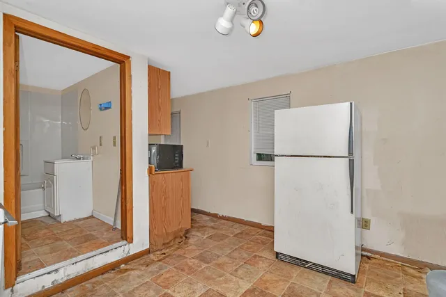 a view of storage and utility room with washer and dryer