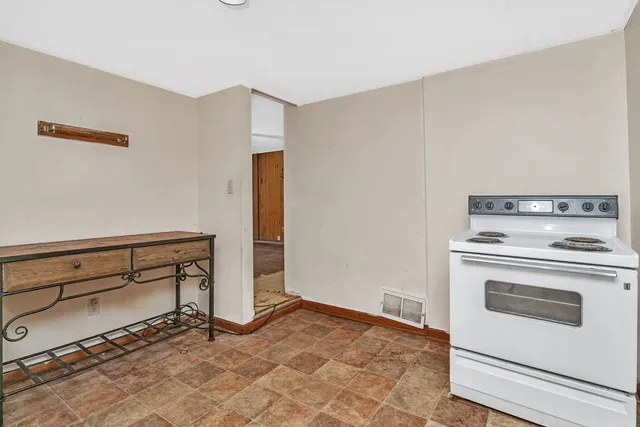 a kitchen with stainless steel appliances granite countertop a sink and a microwave