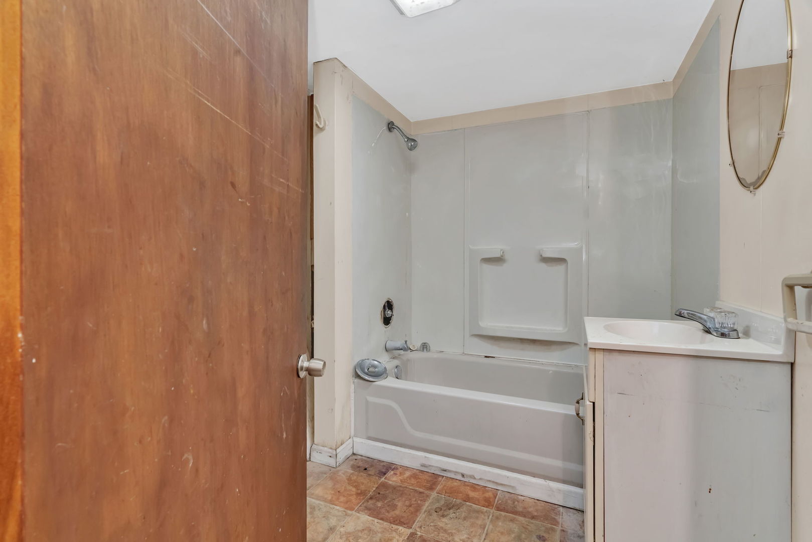 1108 East 9th Street Lockport, IL 60441 - Photo 19 of 22 a bathroom with a sink and a mirror