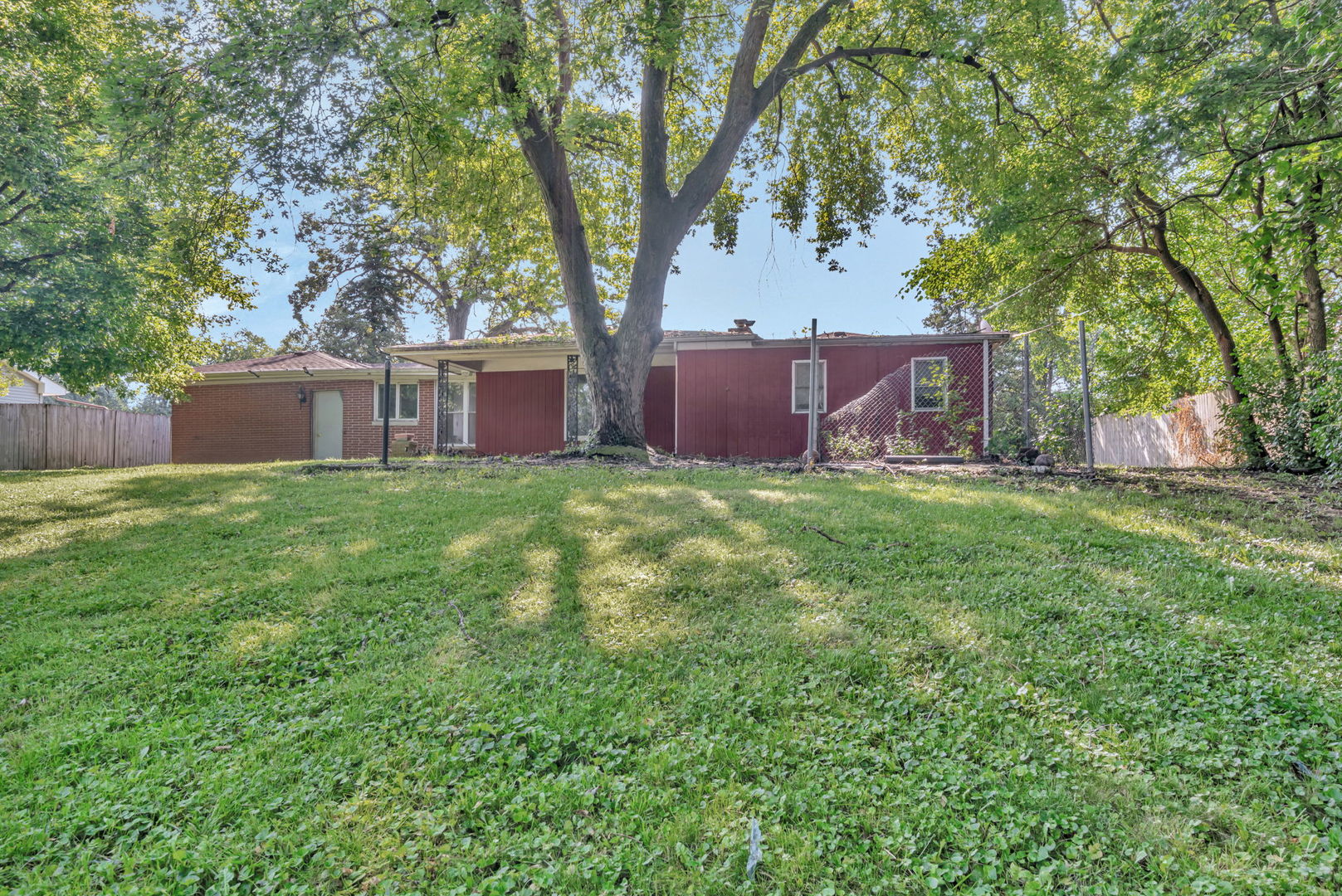 1108 East 9th Street Lockport, IL 60441 - Photo 21 of 22 a view of a house with a yard and a bench