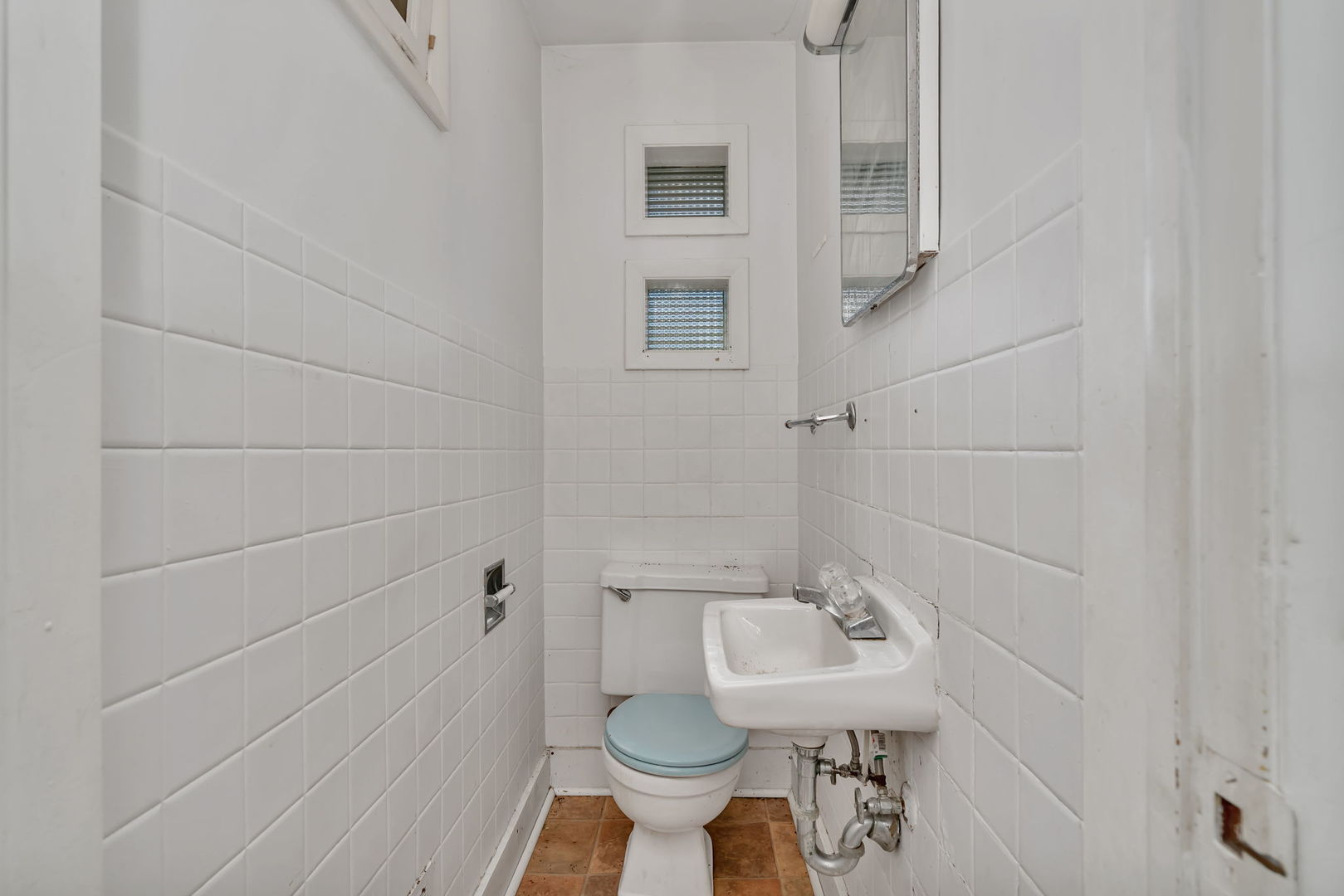 1108 East 9th Street Lockport, IL 60441 - Photo 6 of 22 a bathroom with a sink toilet and shower