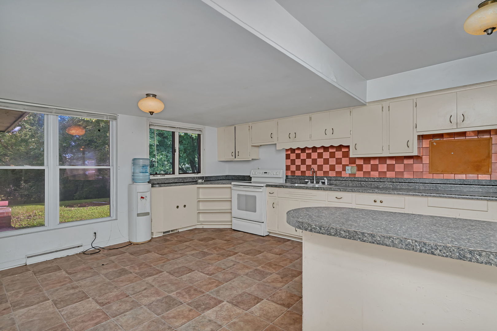 1108 East 9th Street Lockport, IL 60441 - Photo 7 of 22 a kitchen with granite countertop a sink stainless steel appliances and cabinets