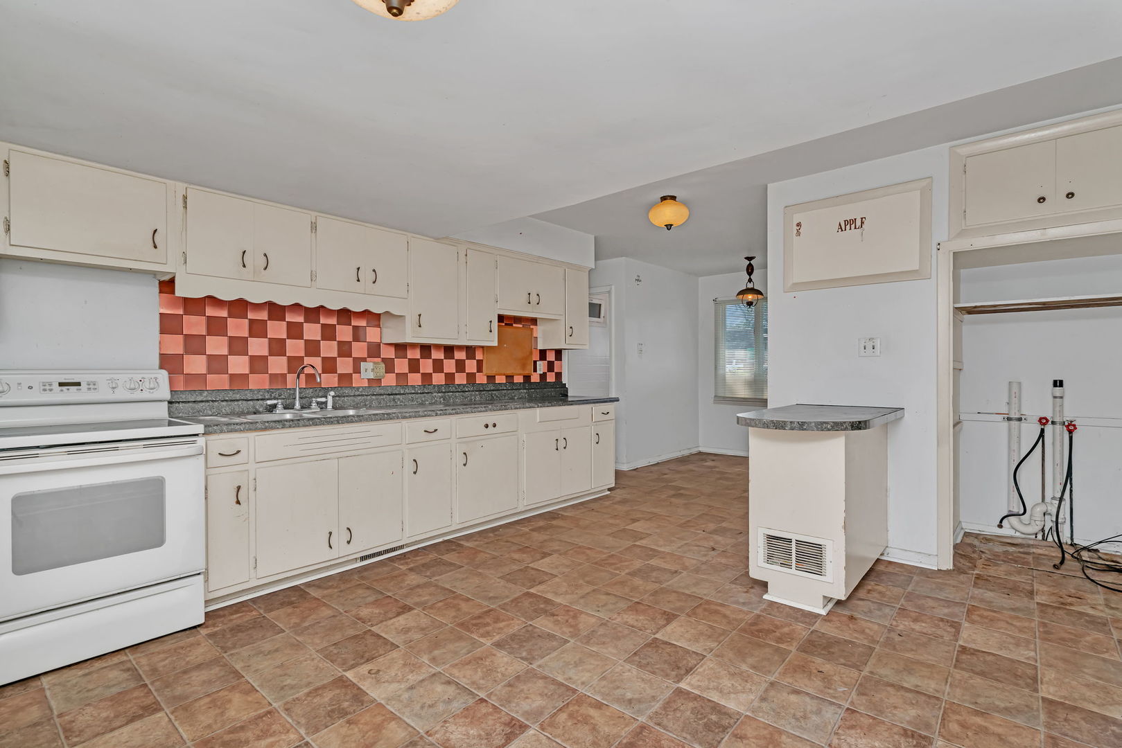 1108 East 9th Street Lockport, IL 60441 - Photo 8 of 22 a kitchen with white cabinets and white appliances