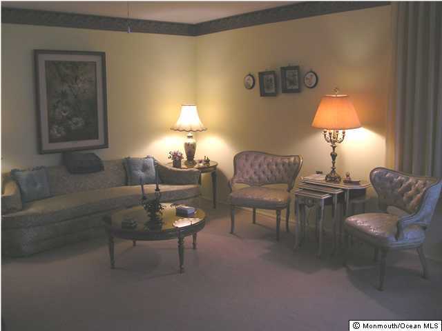 42 Sycamore Access Road Manahawkin, NJ 08050 - Photo 3 of 3 a living room with furniture and a lamp