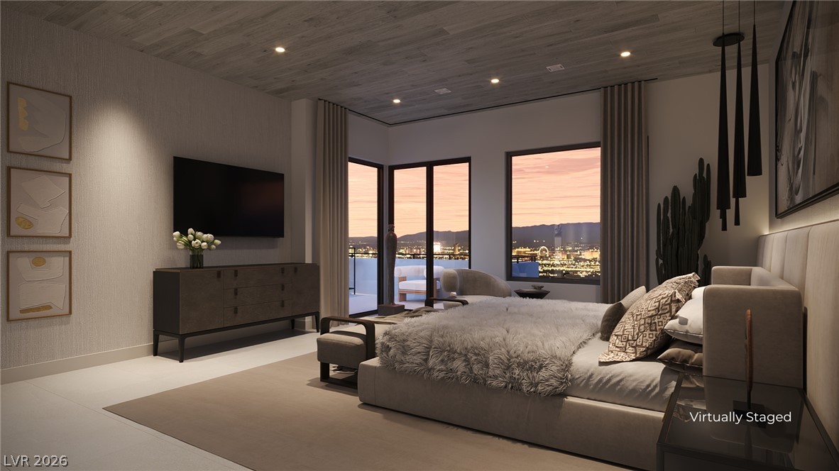 505 Overlook Rim Drive Henderson, NV 89012 - Photo 12 of 22 City views and a private balcony elevate this refined bedroom retreat.