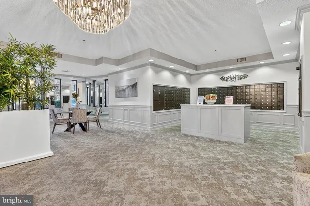 a view of a livingroom with furniture and a kitchen
