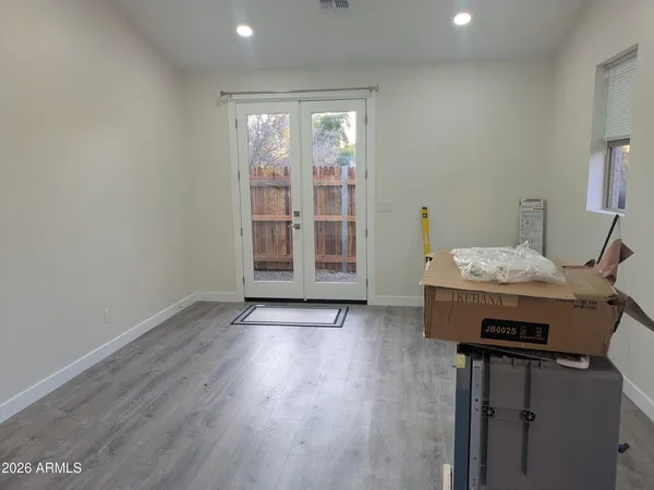 a view of a hallway with wooden floor