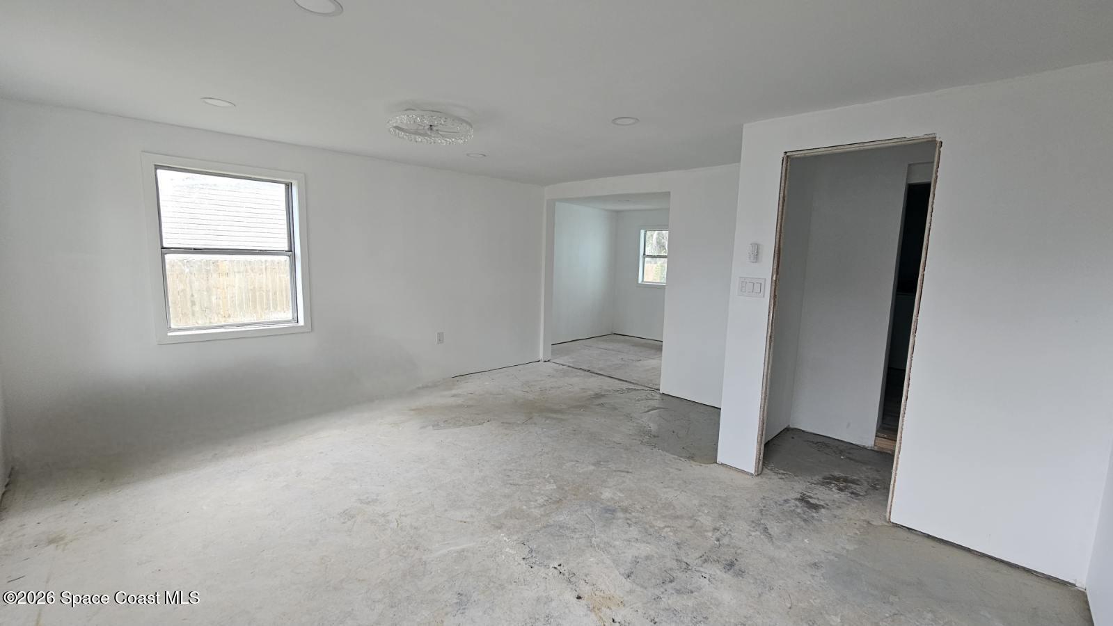 1925 Monticello Avenue Merritt Island, FL 32952 - Photo 9 of 17 an empty room with windows and closet
