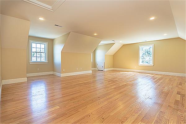 28 Robinson Road Lexington, MA 02420 - Photo 7 of 11 an empty room with wooden floor and windows