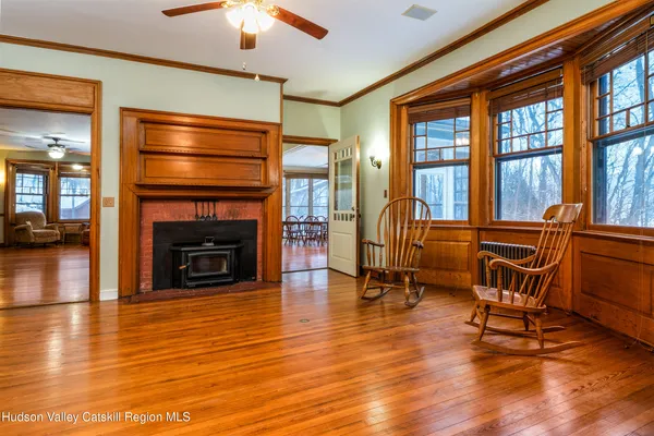 a bathroom with a window and a shower