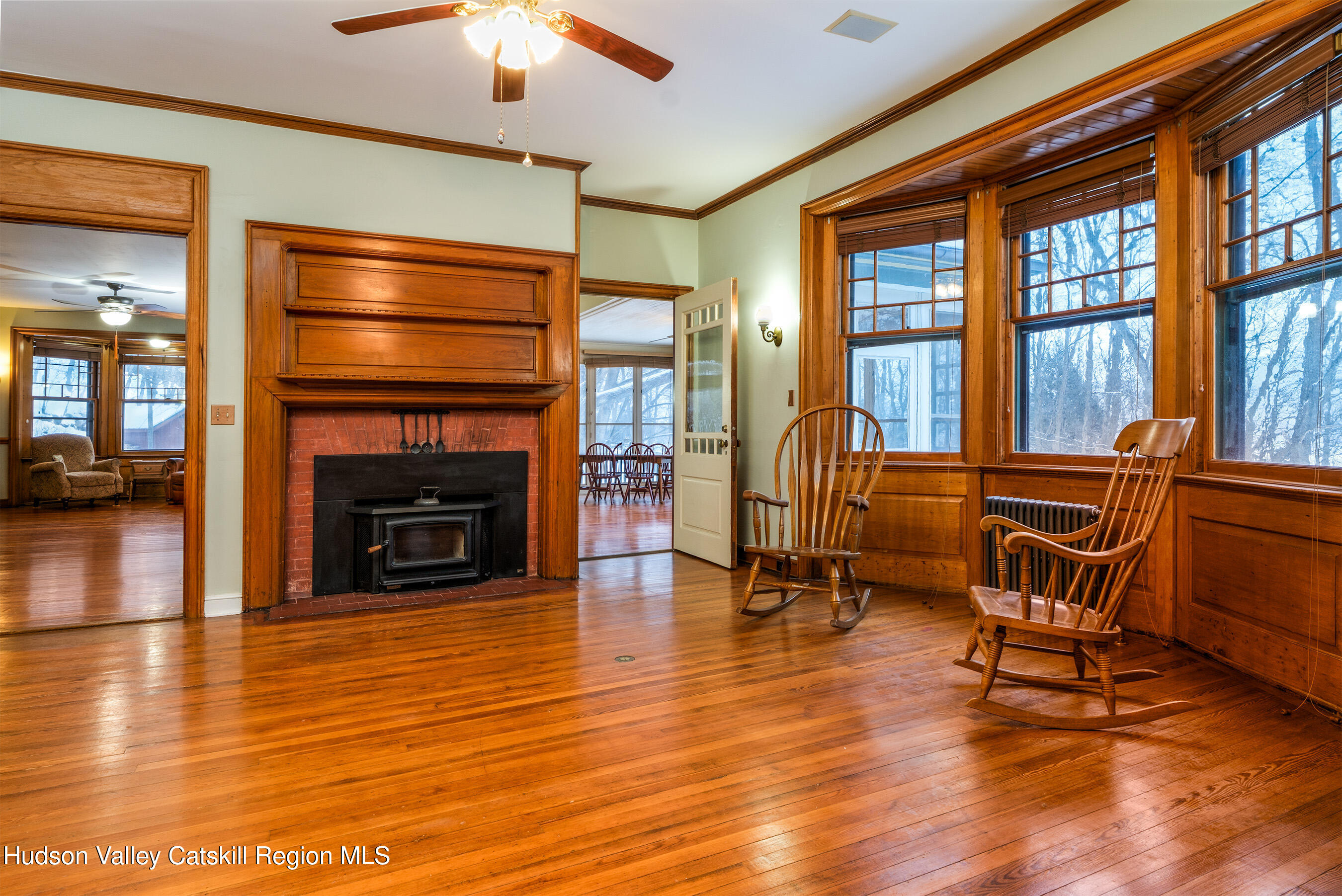 6 Westridge Road Cooperstown, NY 13326 - Photo 20 of 109 a living room with furniture a fireplace and a chandelier
