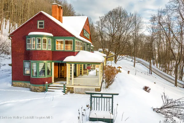 a view of a balcony with chair and table
