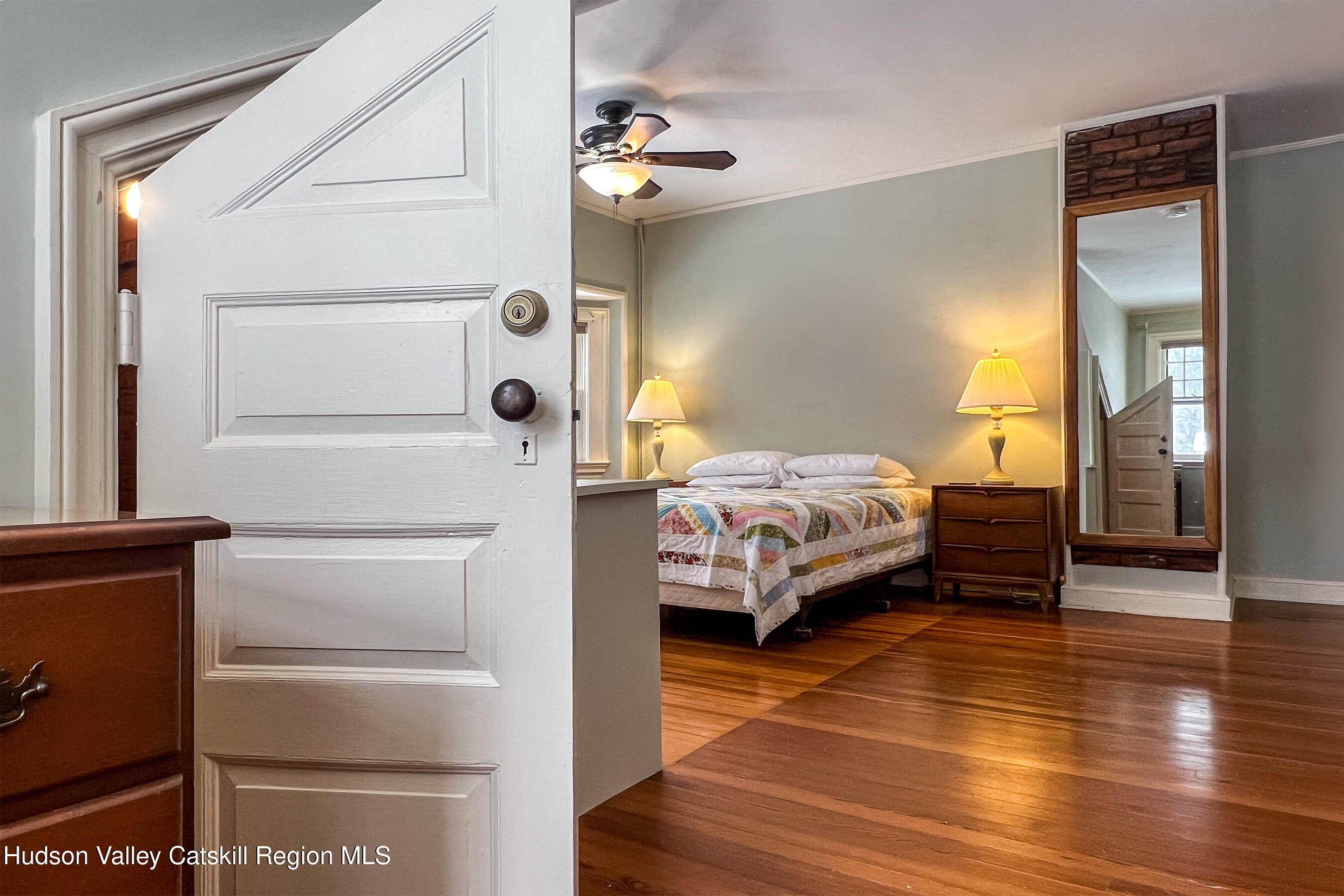 6 Westridge Road Cooperstown, NY 13326 - Photo 66 of 109 a bedroom with a bed and a chandelier