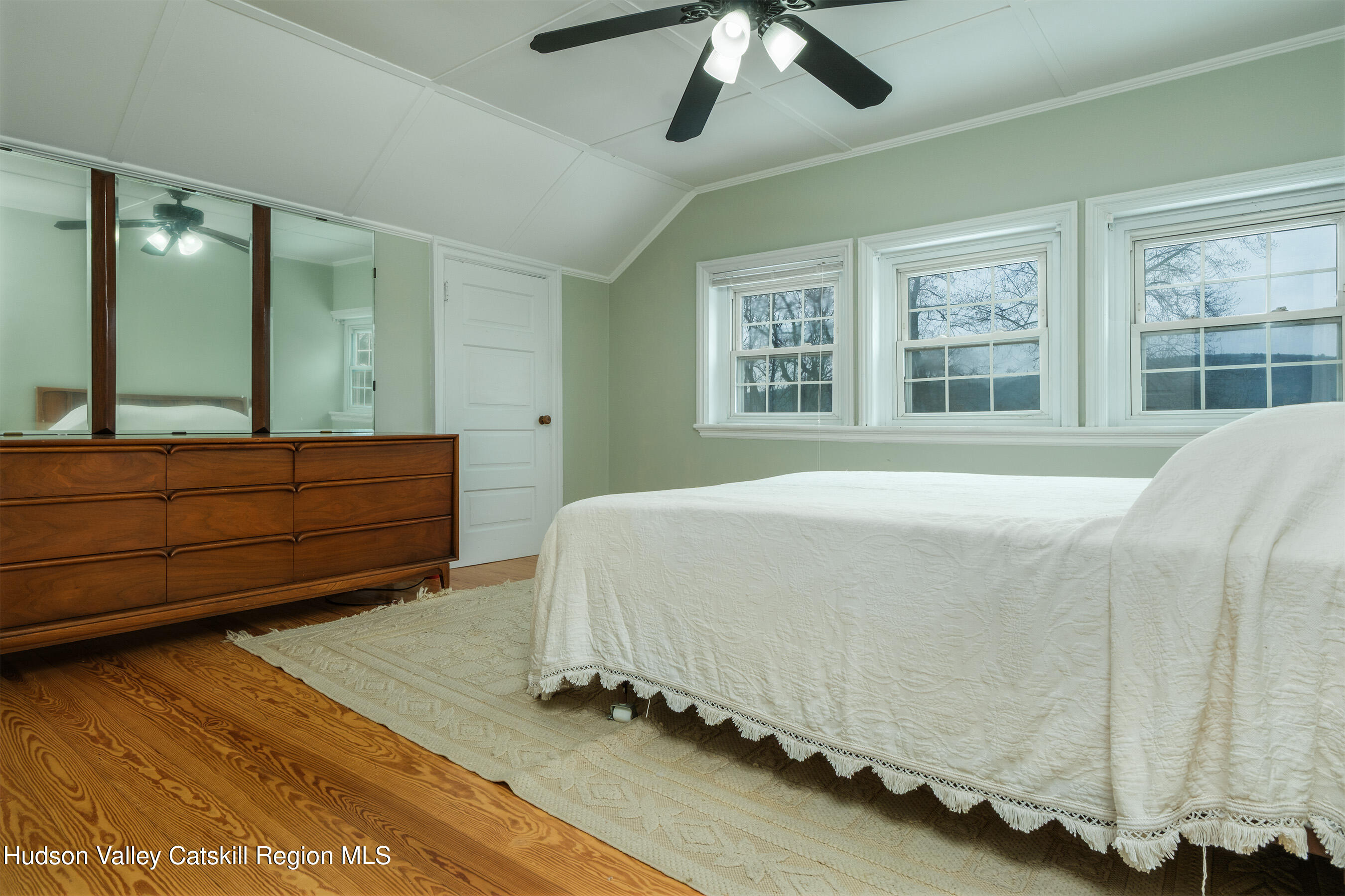 6 Westridge Road Cooperstown, NY 13326 - Photo 79 of 109 a bedroom with a large bed and a chandelier