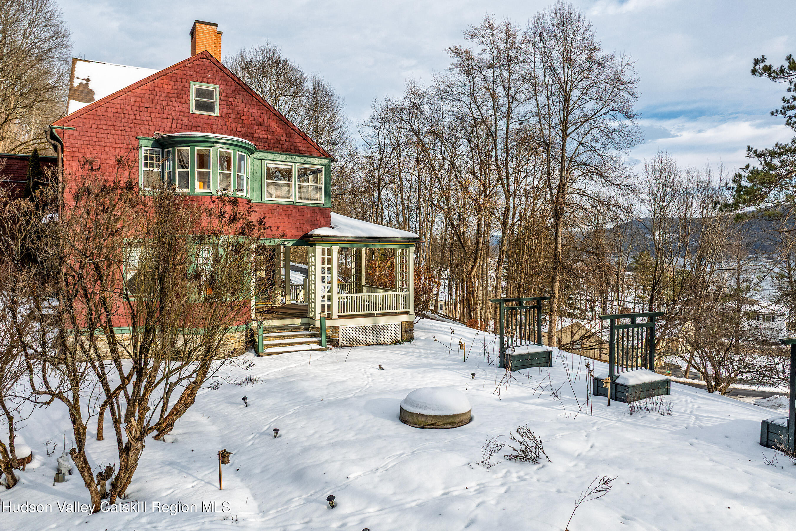 6 Westridge Road Cooperstown, NY 13326 - Photo 98 of 109 a front view of a house with garden and sitting area