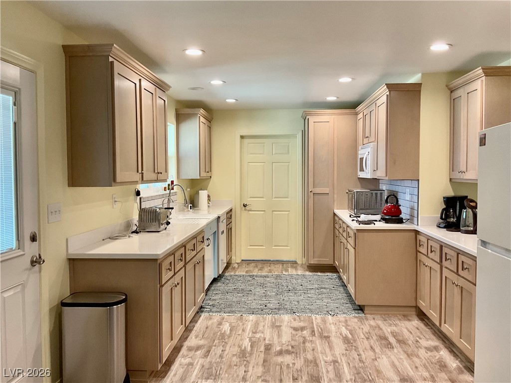 5261 East Kellogg Road Pahrump, NV 89061 - Photo 11 of 28 Kitchen complete with soft close cabinet doors and drawers. All the lower cabinets have pullout shelves all with access to the Laundry Room