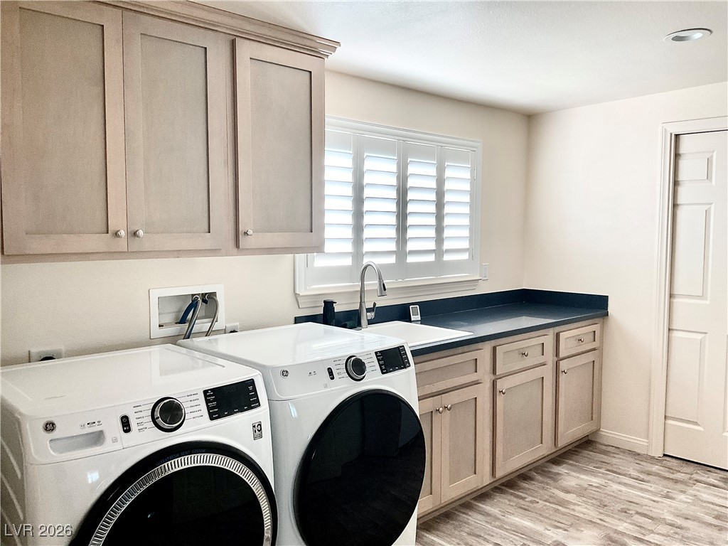 5261 East Kellogg Road Pahrump, NV 89061 - Photo 12 of 28 Large laundry room off the kitchen complete with sink and cabinets